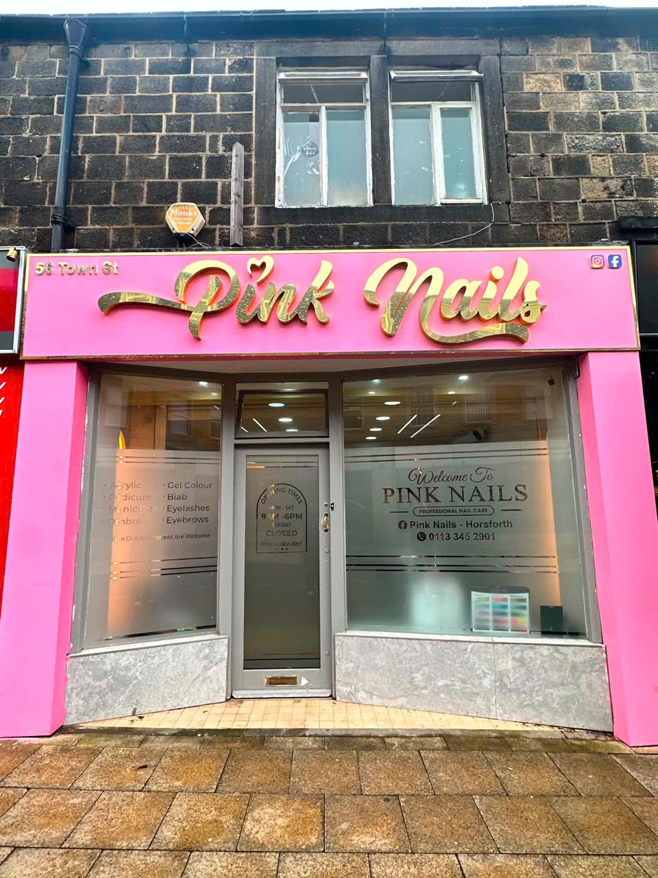 The gold Pink Nails lettering on the bright pink shopfront at 56 Town Street